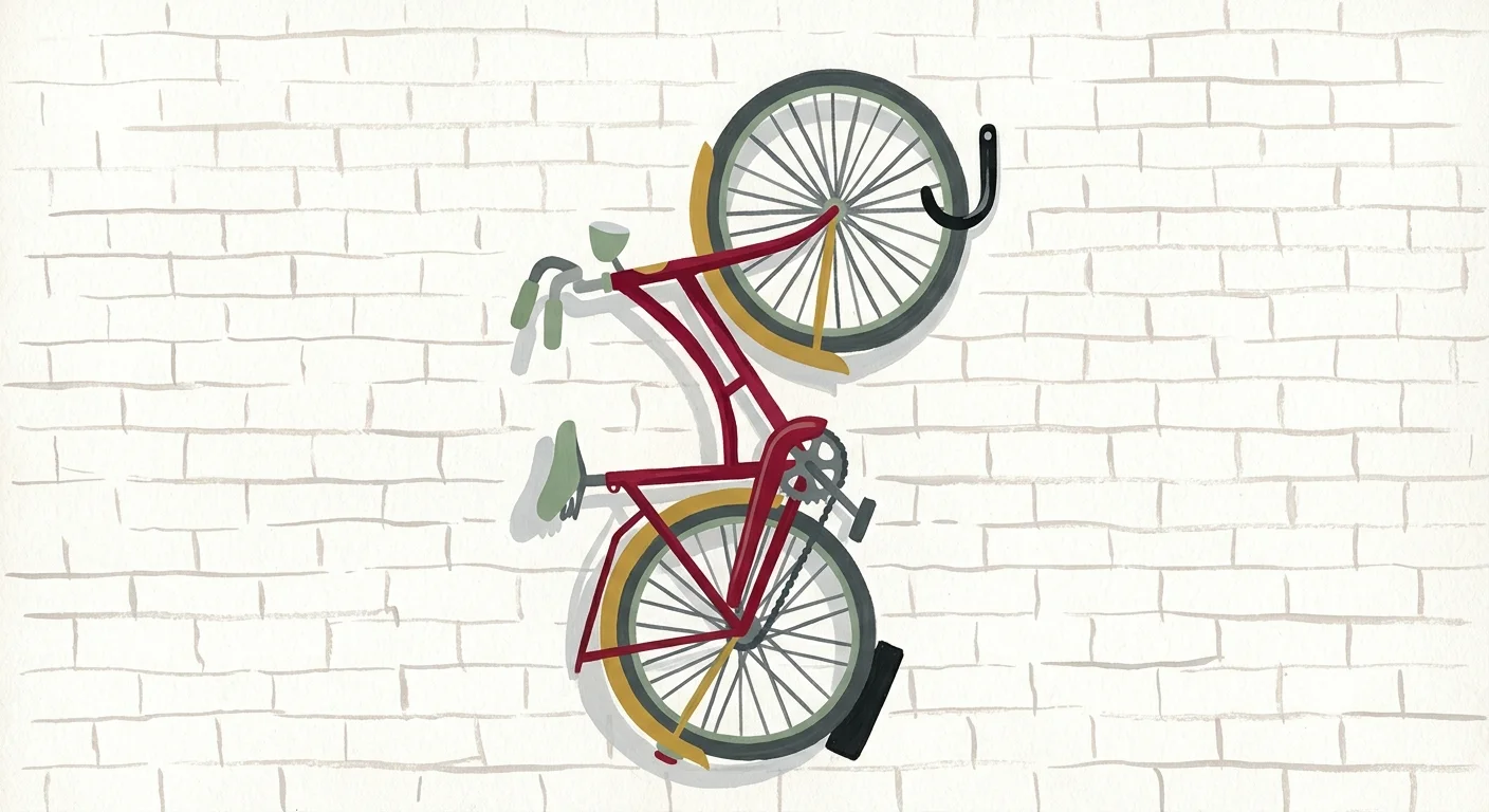 Gouache illustration of a classic red bicycle hanging vertically on a white brick wall using a wall-mounted hook.